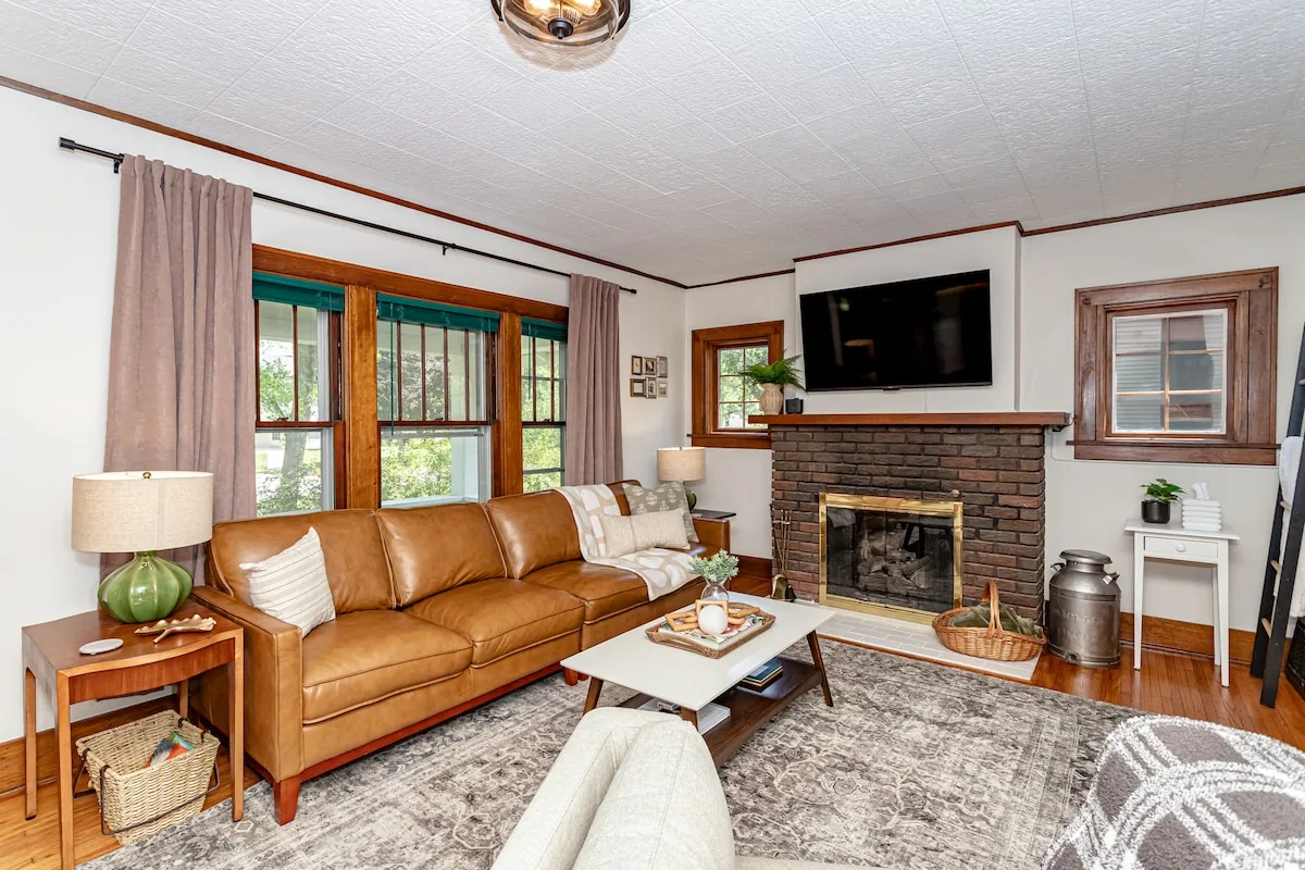 Cozy living room with fireplace in a Stay-A-While managed Ames rental